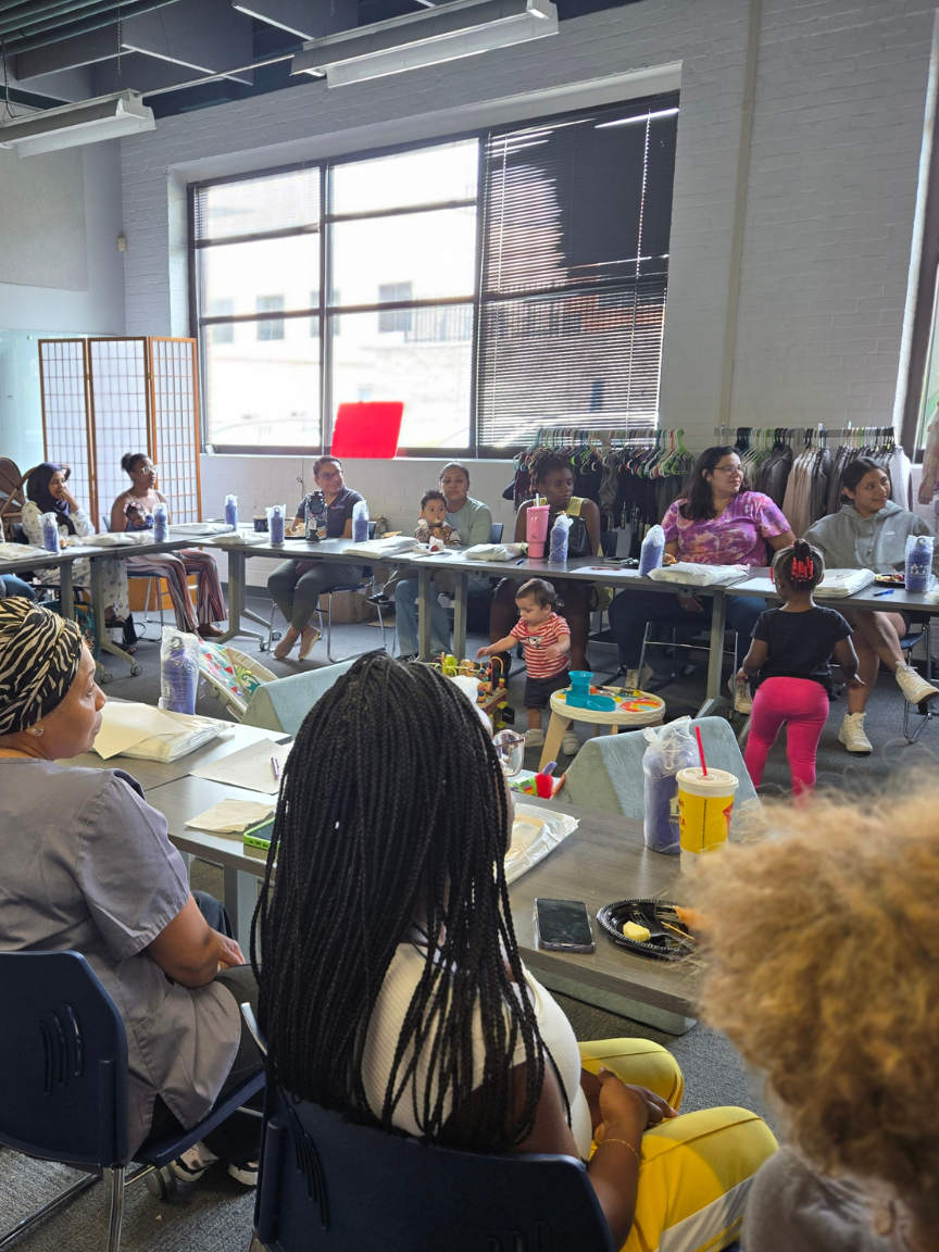 Parents gathered in a supportive group setting at a Circle of Parents meeting